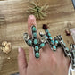 Blue cactus with flower with turquoise rings